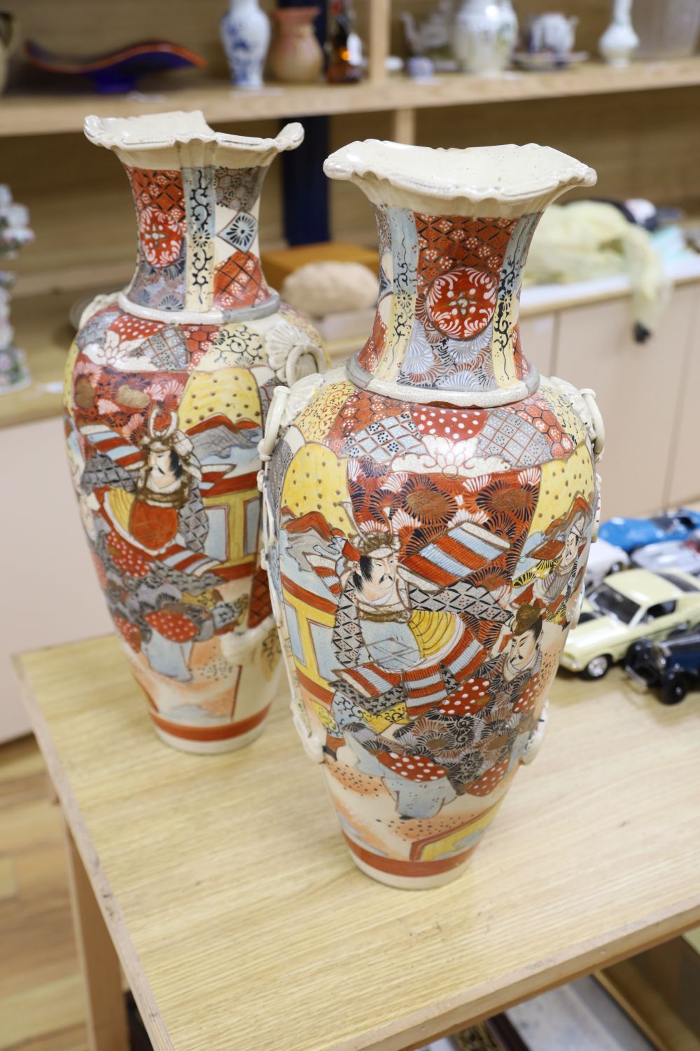 A pair of 19th century Satsuma vases, brocaded with figures, height 58cm (one a.f.)